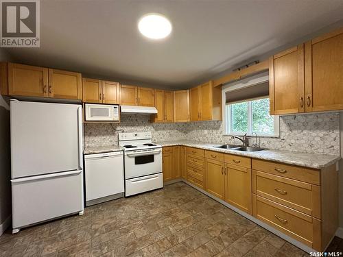 13 Oswalt Street, Quill Lake, SK - Indoor Photo Showing Kitchen With Double Sink