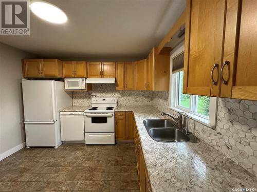 13 Oswalt Street, Quill Lake, SK - Indoor Photo Showing Kitchen With Double Sink