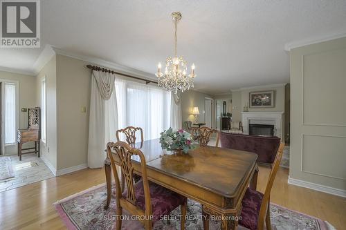 12 - 65 Fiddlers Green Road, London, ON - Indoor Photo Showing Dining Room With Fireplace