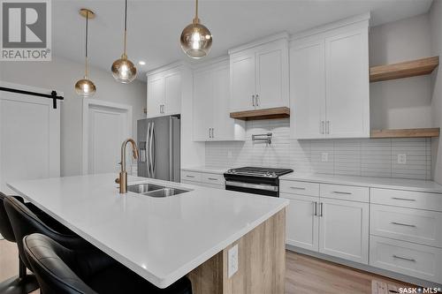 936 Feheregyhazi Boulevard, Saskatoon, SK - Indoor Photo Showing Kitchen With Double Sink With Upgraded Kitchen