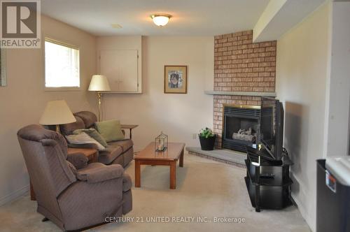 854 Stewart Drive, Peterborough (Ashburnham), ON - Indoor Photo Showing Living Room With Fireplace