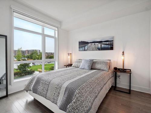 Chambre Ã Â coucher - 204-1255 Rue Des Francs-Bourgeois, Boisbriand, QC - Indoor Photo Showing Bedroom