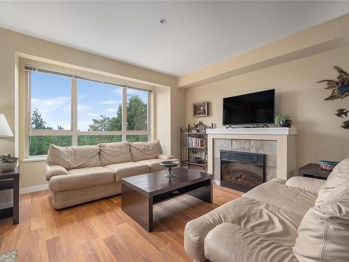 308-297 Hirst Ave West, Parksville, BC - Indoor Photo Showing Living Room With Fireplace