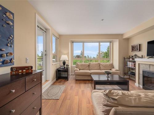 308-297 Hirst Ave West, Parksville, BC - Indoor Photo Showing Living Room With Fireplace