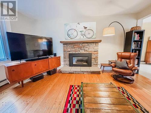 189 Farah Avenue, Temiskaming Shores, ON - Indoor Photo Showing Living Room With Fireplace