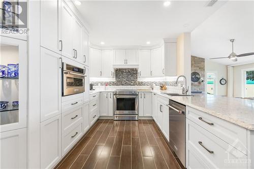 Oven with warming drawer. Built in microwave with convection oven. - 134 Bayview Drive, Ottawa, ON - Indoor Photo Showing Kitchen With Upgraded Kitchen