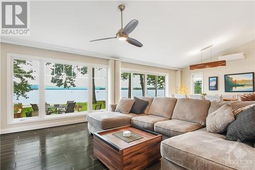 A wall of windows including a patio door - 134 Bayview Drive, Ottawa, ON - Indoor Photo Showing Living Room