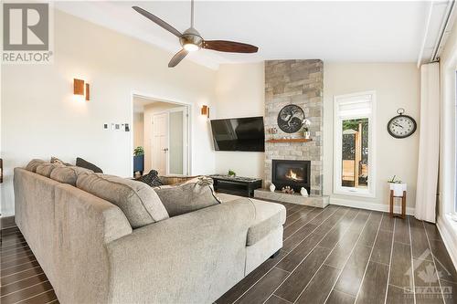 Stunning Italian floor tiles - 134 Bayview Drive, Ottawa, ON - Indoor Photo Showing Living Room With Fireplace