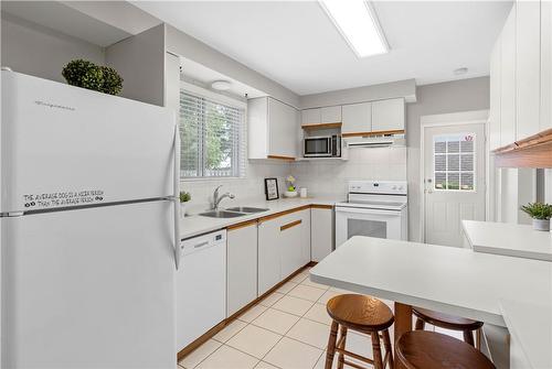 View of the pool - 1340 Humphreys Crescent, Burlington, ON - Indoor Photo Showing Kitchen With Double Sink