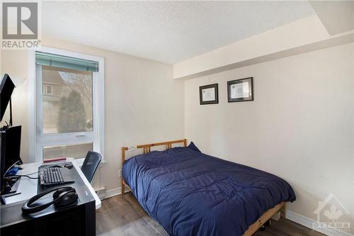 Second bedroom laminate floor - 939 North River Road Unit#104, Ottawa, ON - Indoor Photo Showing Bedroom