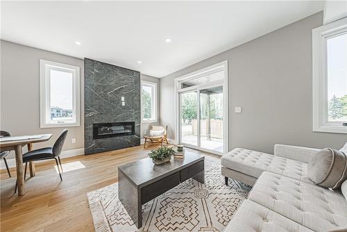 model home - 6220 Curlin Crescent, Niagara Falls, ON - Indoor Photo Showing Living Room With Fireplace