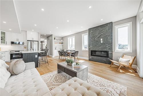 model home - 6220 Curlin Crescent, Niagara Falls, ON - Indoor Photo Showing Living Room With Fireplace