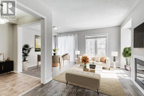 266 - 7360 Zinnia Place, Mississauga (Meadowvale Village), ON - Indoor Photo Showing Living Room With Fireplace