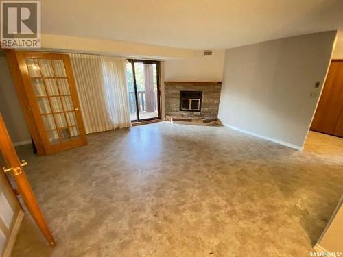 8 111 Fenson Crescent, Yorkton, SK - Indoor Photo Showing Living Room With Fireplace