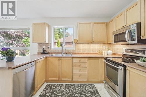 166 58Th Street S, Wasaga Beach, ON - Indoor Photo Showing Kitchen With Double Sink