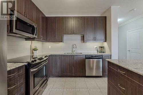 216 - 33 Whitmer Street, Milton (Scott), ON - Indoor Photo Showing Kitchen With Double Sink With Upgraded Kitchen