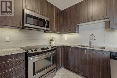 216 - 33 Whitmer Street, Milton, ON - Indoor Photo Showing Kitchen With Double Sink With Upgraded Kitchen