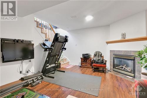 928 Goose River Avenue, Ottawa, ON - Indoor Photo Showing Gym Room With Fireplace