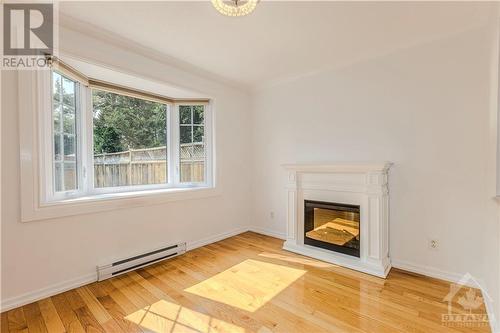 Large Bay window in Dining Room brings in tons of natural lights - 106 Mcclellan Road, Ottawa, ON - Indoor Photo Showing Living Room With Fireplace