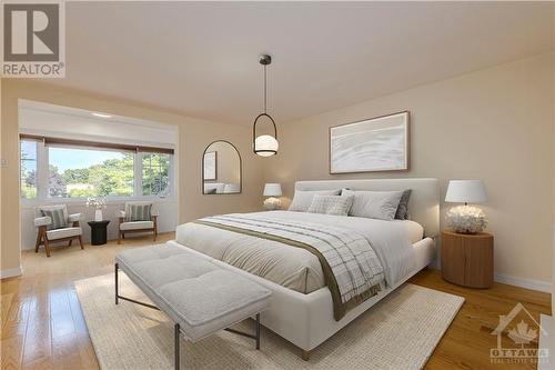 Digitally staged primary bedroom with bonus sitting/reading/exercising area and hardwood floor - 106 Mcclellan Road, Ottawa, ON - Indoor Photo Showing Bedroom