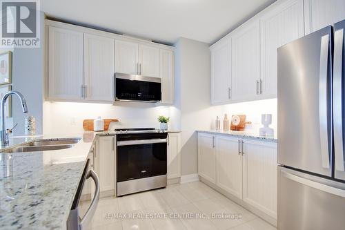 316 - 830 Megson Terrace, Milton, ON - Indoor Photo Showing Kitchen With Double Sink With Upgraded Kitchen