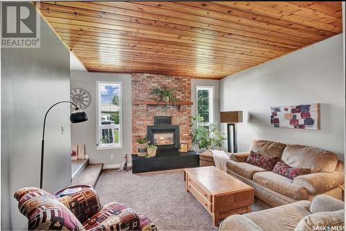 14 Mccully Crescent, Saskatoon, SK - Indoor Photo Showing Living Room With Fireplace