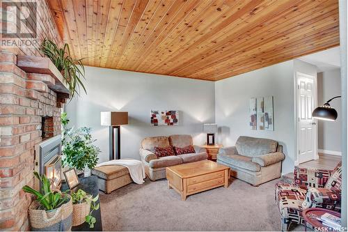 14 Mccully Crescent, Saskatoon, SK - Indoor Photo Showing Living Room With Fireplace