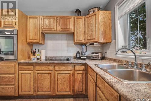 14 Mccully Crescent, Saskatoon, SK - Indoor Photo Showing Kitchen With Double Sink