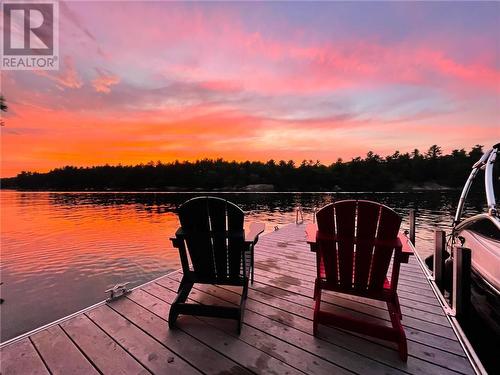 Beautiful sunsets. - 1325 Nordic Road, Arden, ON - Outdoor With Body Of Water With View