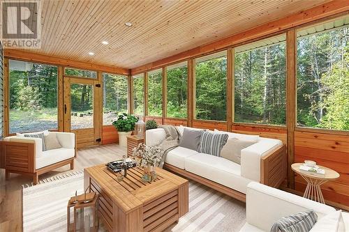 Virtually staged conception of "porch potential". - 1325 Nordic Road, Arden, ON - Indoor Photo Showing Living Room