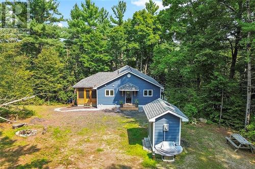 Majestically framed by towering trees. - 1325 Nordic Road, Arden, ON - Outdoor