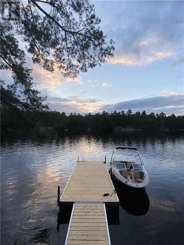 Enjoy this view after great day on the water. - 1325 Nordic Road, Arden, ON - Outdoor With Body Of Water With View