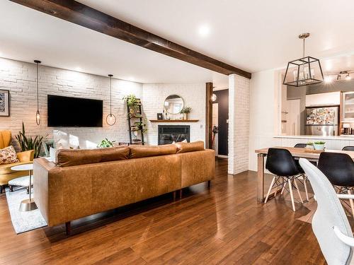 Overall view - 102-2800A Rue St-Patrick, Montréal (Le Sud-Ouest), QC - Indoor Photo Showing Living Room With Fireplace