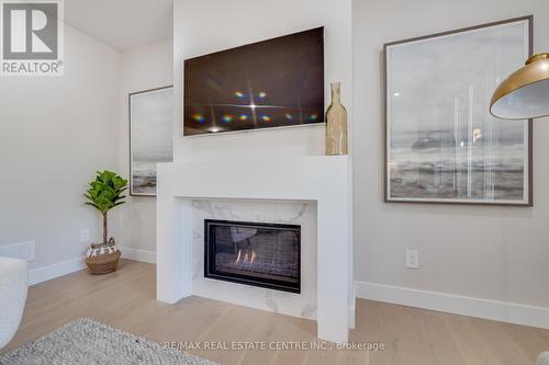 6 - 7966 Fallon Drive, London, ON - Indoor Photo Showing Other Room With Fireplace