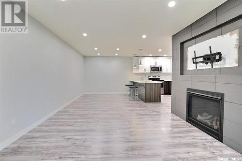 218 160 Gore Place, Regina, SK - Indoor With Fireplace