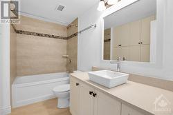 Main updated bath with lots of cabinetry - 