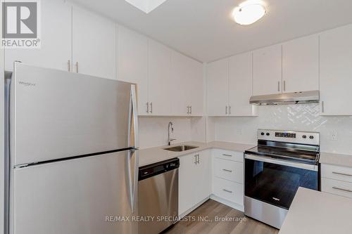 726 - 3200 William Coltson Avenue, Oakville, ON - Indoor Photo Showing Kitchen With Stainless Steel Kitchen