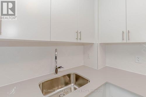 726 - 3200 William Coltson Avenue, Oakville, ON - Indoor Photo Showing Kitchen With Double Sink