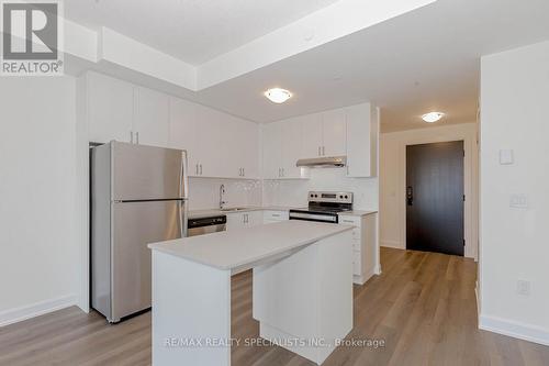 726 - 3200 William Coltson Avenue, Oakville, ON - Indoor Photo Showing Kitchen With Stainless Steel Kitchen