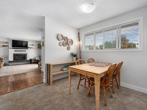 1240 Semlin Drive, Ashcroft, BC - Indoor Photo Showing Dining Room With Fireplace