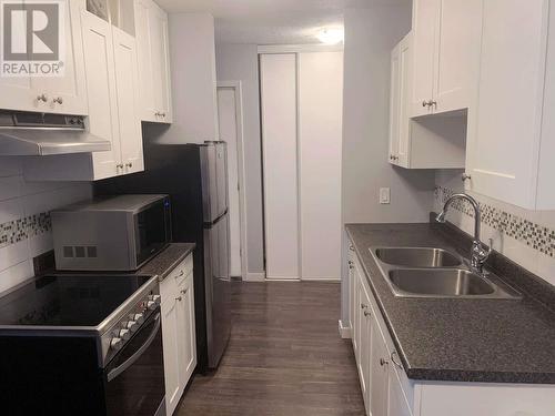 445 All Star Court Unit# 301, Kelowna, BC - Indoor Photo Showing Kitchen With Double Sink