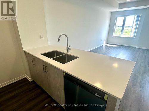 283 - 140 Honeycrisp Crescent, Vaughan, ON - Indoor Photo Showing Kitchen With Double Sink