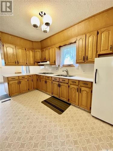 621 Herbert Street, Brownlee, SK - Indoor Photo Showing Kitchen With Double Sink