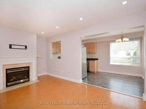 113-5260 Mcfarren Blvd, Mississauga, ON - Indoor Photo Showing Living Room With Fireplace