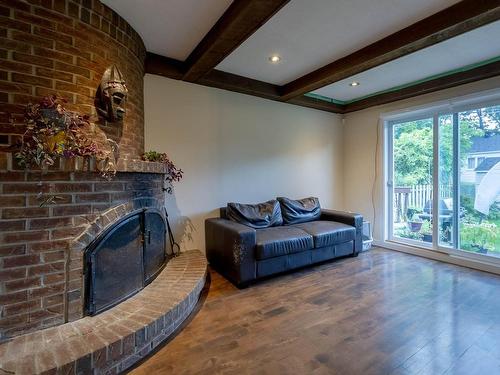 Salle familiale - 7255 Rue Messier, Brossard, QC - Indoor Photo Showing Living Room With Fireplace