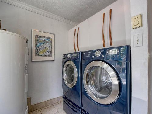 Salle de lavage - 15 Rue Alfred, Laval (Sainte-Rose), QC - Indoor Photo Showing Laundry Room