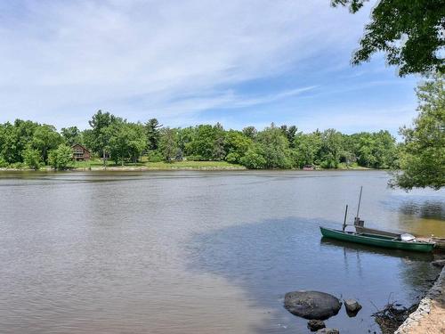 Vue sur l'eau - 15 Rue Alfred, Laval (Sainte-Rose), QC - Outdoor With Body Of Water With View