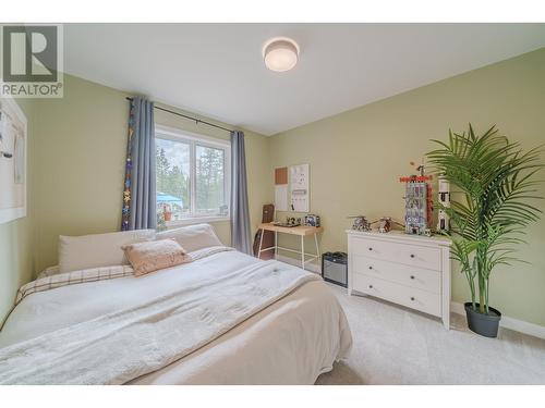 4878 Gloinnzun Drive, 108 Mile Ranch, BC - Indoor Photo Showing Bedroom