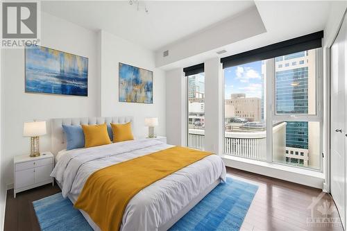 This photo has been virtually staged. - 40 Nepean Street Unit#1003, Ottawa, ON - Indoor Photo Showing Bedroom