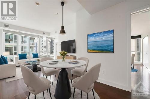 This photo has been virtually staged. - 40 Nepean Street Unit#1003, Ottawa, ON - Indoor Photo Showing Dining Room